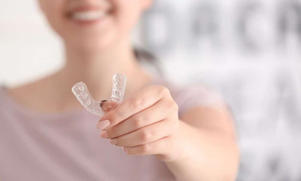 Woman holding Invisalign