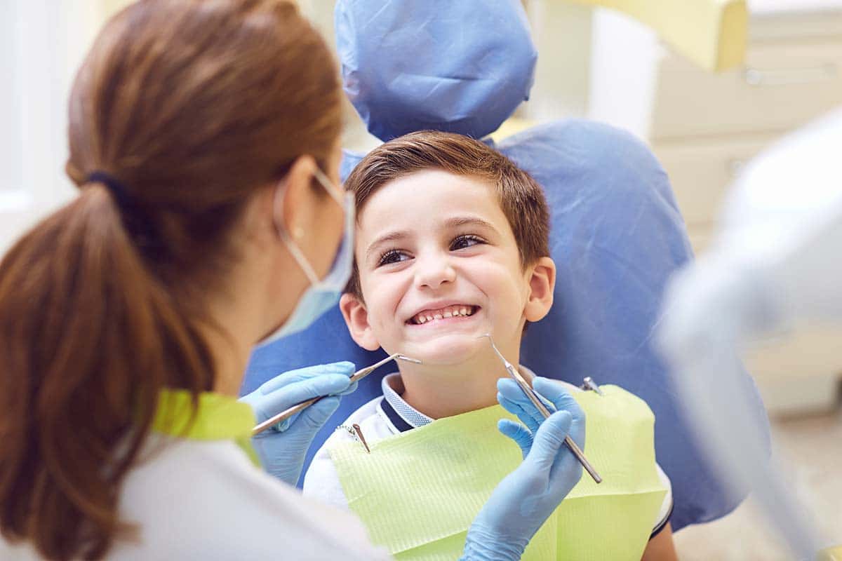 Child getting dental sealant