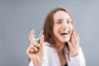 middle aged woman with Invisalign