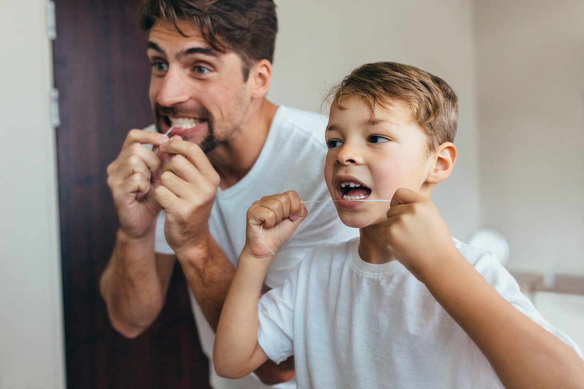 Kid Flossing with Father