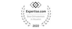 A monochrome badge featuring laurel branches and a geometric logo highlights that Elara Orthodontics was recognized among the "Expertise.com Best Orthodontists in Houston 2022" in Richmond or Houston, TX.